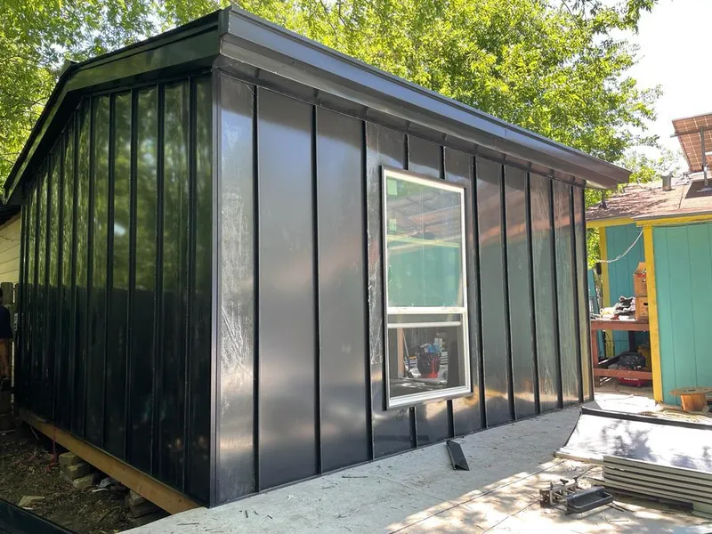 Black standing seam metal wall panels for Roof Inspection in Eagleton Village