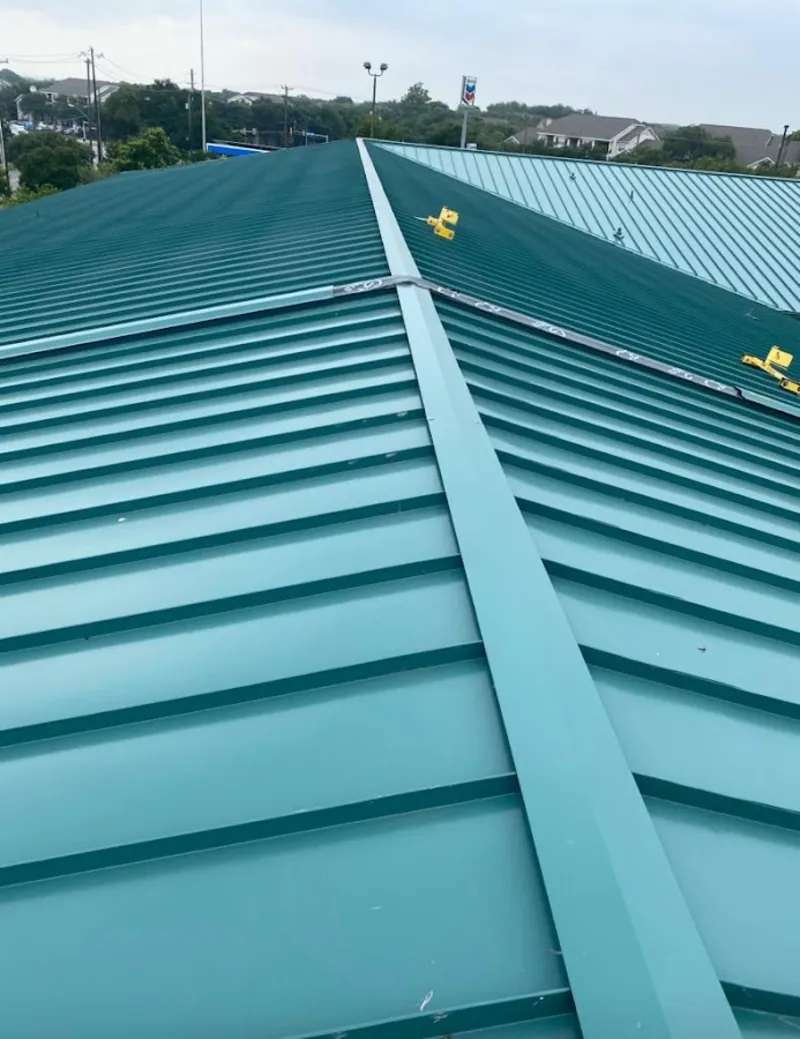 Green commercial metal roof ridge and valley for Metal Roof Repair in Eagleton Village
